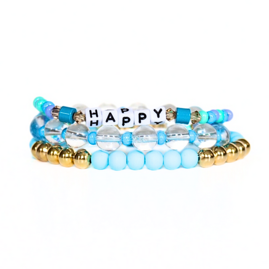 Blue beaded bracelet set with clear quartz gemstones, acrylic blue beads and custom word bracelet