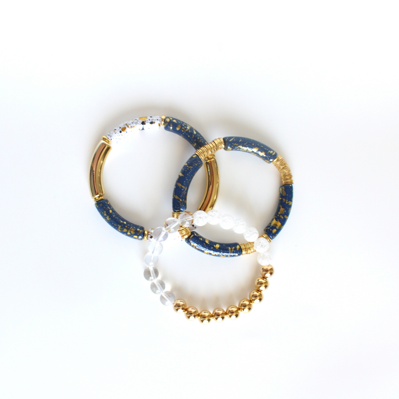 Three Piece stretch beaded bracelet set featuring 18k gold filled beads, natural semi-precious gemstones. This set includes one beaded bracelet and two bangle style bracelets. Wear this stack with your holiday outfit for some extra sparkle