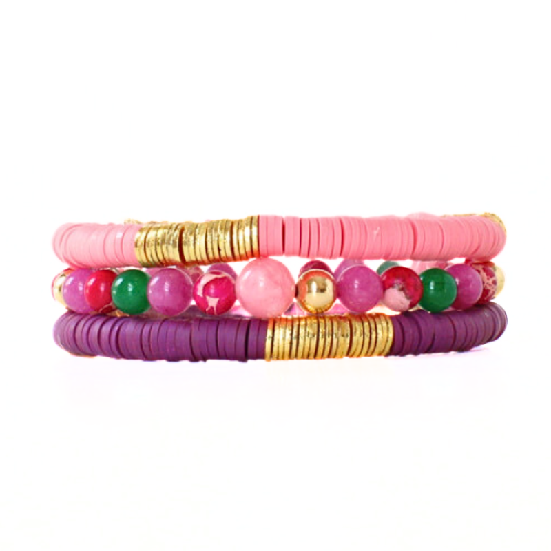 3-piece bracelet stack designed with pink and purple polymer clay beads accented with gold-plated flat beads. This bracelet stack is complimented with a pink, green and purple beaded bracelet designed with pink and purple jade beads and gold-filled beads