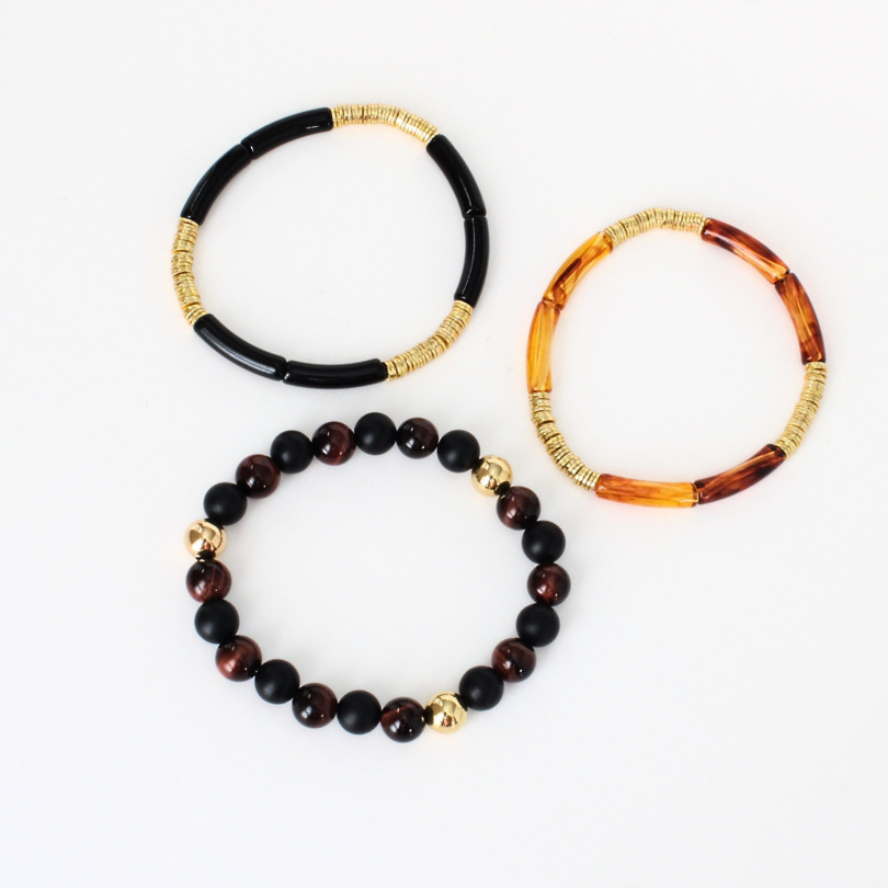 3-piece black and brown acrylic beaded bracelet stack. This bracelet is also designed with red's eye and onyx gemstones.