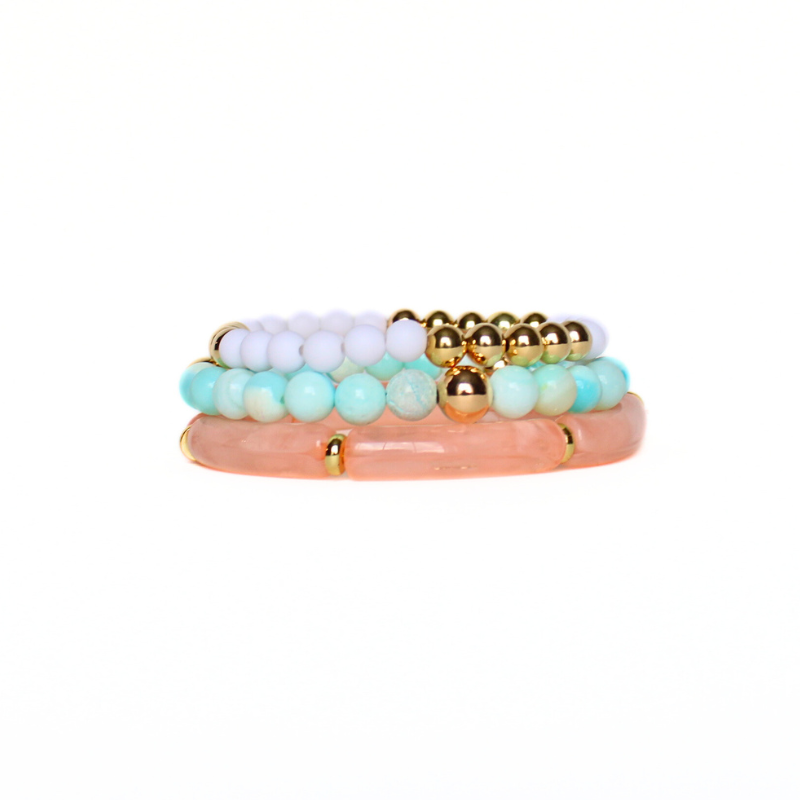 3-piece blue opal gemstone bracelet stack styled with peach marble acrylic bangle and a white acrylic beaded bracelet with gold-filled round beads
