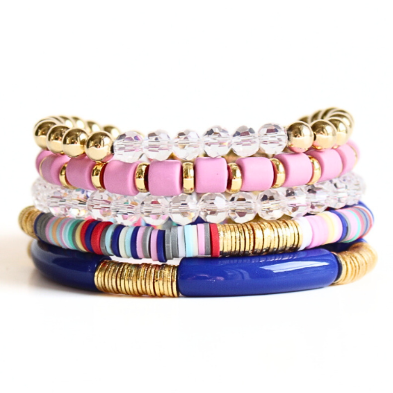 5-piece blue and purple beaded bracelet stack. Designed with royal blue acrylic tube bangle bracelet, purple wide polymer clay beads, gold-filled beaded bracelet with clear glass beads.