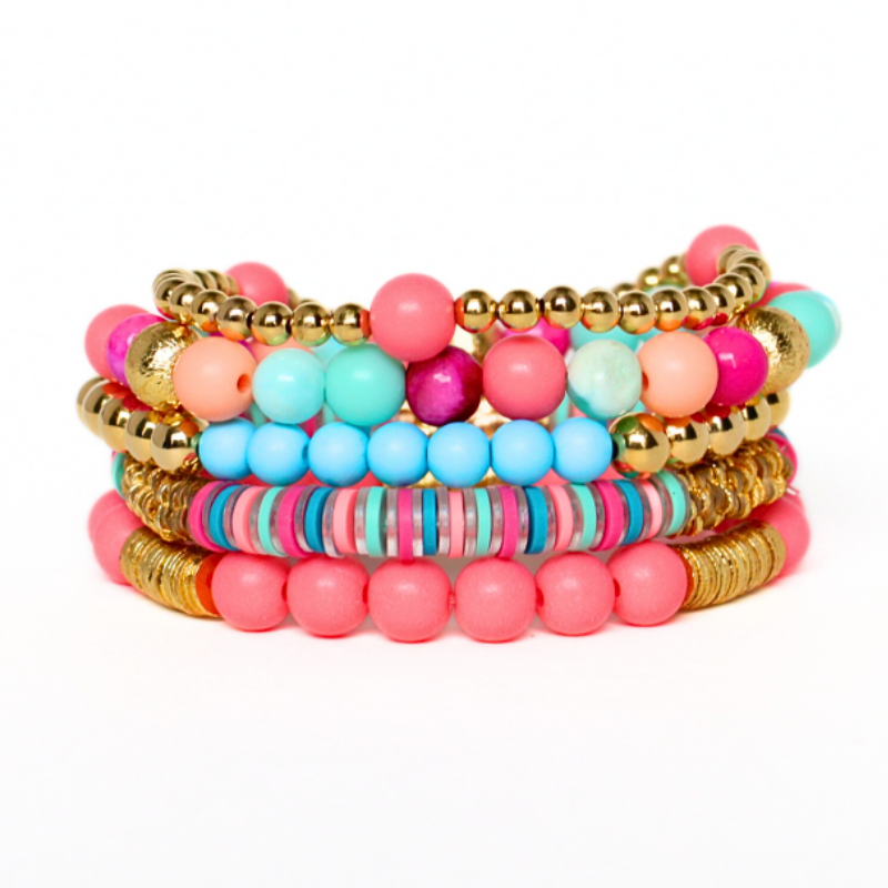 Bright pink and blue beaded stretch bracelet set. This set features pink and blue acrylic beads and gold beads.