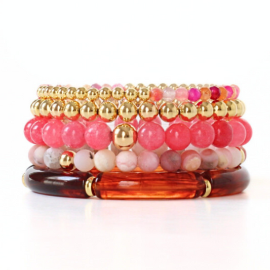 3-pece bracelet stack designed with chakra, moonstone and sunstone healing beads. Also designed with a dainty brown marble skinny acrylic bangle and a dainty gold-filled beaded bracelet with coral and magenta faceted agate beads.