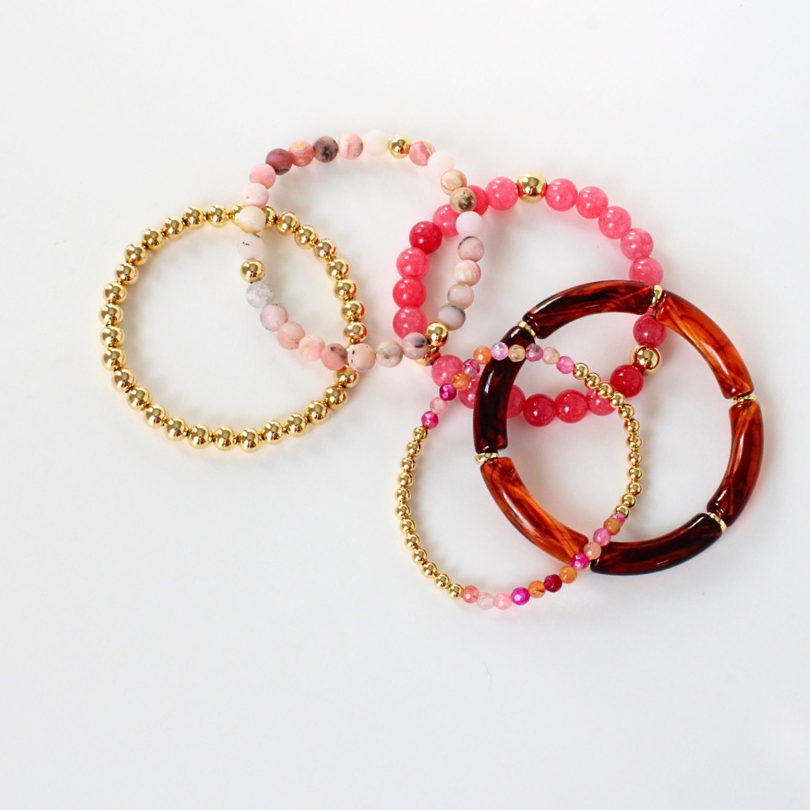 5-piece pink and brown bracelet stack. This bracelet stack has a two-toned marble brown acrylic bangle. Pink adventure opal beads add a feminine look. Dainty pink and orange agate beads with gold filled round beads complete this bracelet