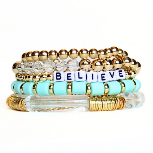 5-Piece 18K gold beaded stretch bracelet set with green polymer clay beads. This bracelet stack has all of the glamour and glitz to complete that perfect outfit. Also designed with white acrylic bangles and white acrylic cubed letter beads which can be personalized.