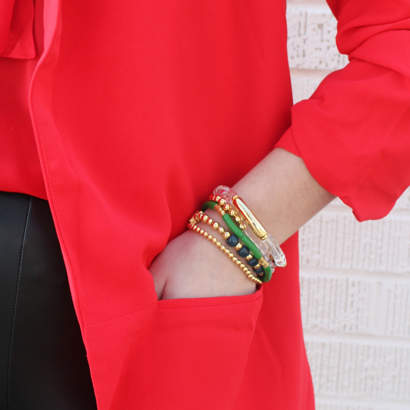 5-Piece 18k gold beaded stretch bracelet with clear round natural Brazilian quartz gemstones. 2 bracelets have green, clear and gold acrylic bangles. This set is also designed with ocean blue forte gemstone beads.