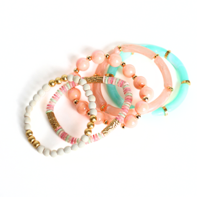 5-Peice bracelet set with 5 separate bracelet styles. Skinny 8mm aqua transparent acrylic tubes and gold flat beads, large peach acrylic round ball beads and 5mm 18k gold filled round beads, 8mm skinny peach marble tubes with flat gold wide beads, 4mm white acrylic round beads with 4mm 18k gold filled round beads and peach, and peach, aqua and clear polymer clay flats.