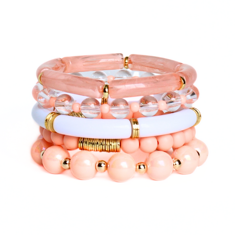 5-peice peach golden hour bracelet stack. This bracelet stack has two 8mm skinny bamboo acrylic tube bangles; peach marble and white. Clear 6mm quartz round beads with alternating 4mm peach acrylic beads. 12mm chunky acrylic round beads with alternating gold filled round beads. And also designed with 6mm peach acrylic round beads with gold plated flats.