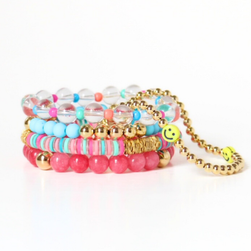 3-peice beach inspired stack. Designed with peach marble 8mm skinny acrylic bamboo tubes with gold plated flats. This stack also is designed with 8mm blue opal beaded bracelet with gold filled beads and a 5mm gold filled beaded bracelet accented with white round acrylic beads.