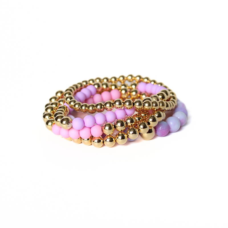 5-piece purple and pink feminine stack. Adorned with 6mm purple opal gemstone beads, pink and purple acrylic beads with 18k gold filled round beads.