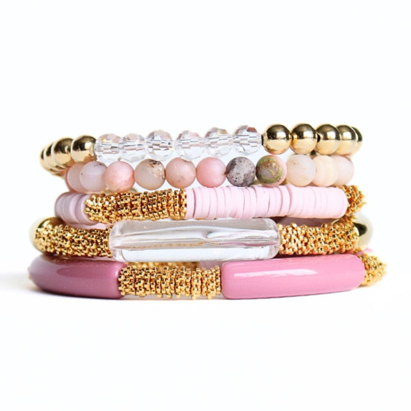 5-piece pink opal gemstone beaded bracelet. With warm pink acrylic bangles and pink polymer clay beads, this bracelet set has a modern feminine look.