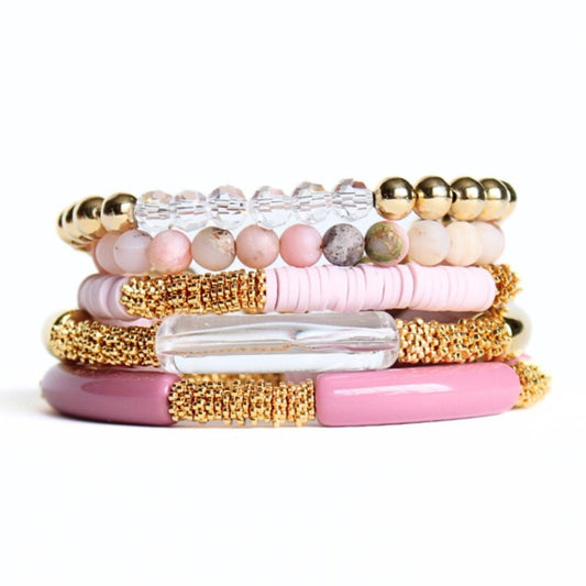 5-piece pink opal gemstone beaded bracelet. With warm pink acrylic bangles and pink polymer clay beads, this bracelet set has a modern feminine look.