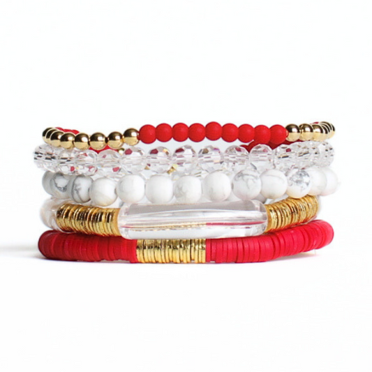 This 5-piece bracelet set is the perfect statement piece. With its bold red colors, it is designed with 18K gold filled beads, clear glass beads, white howlite beads red polymer clay and glass beads.