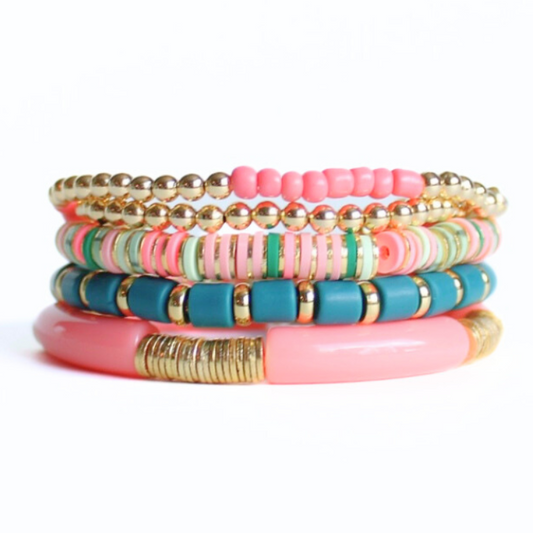 This stunning 5-piece bracelet stack is designed with 18k gold filled round beads with pink and green polymer clay beads. Also designed with pink seed beads and coral acrylic bangles.