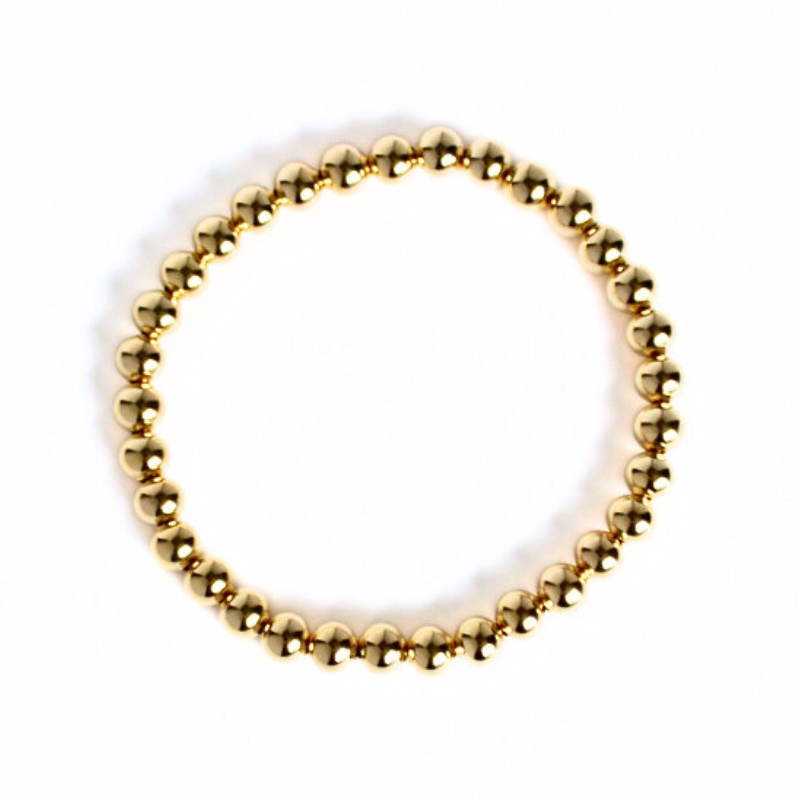 5mm 18k gold-filled beaded stretch bracelet. This bracelet is waterproof and tarnish resistant.