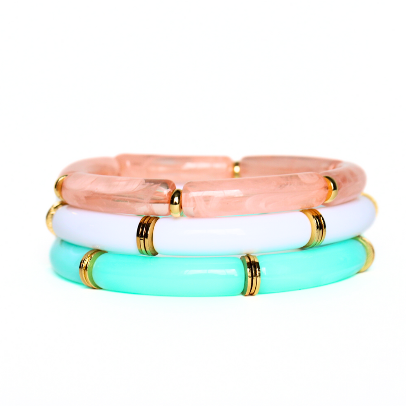 Add this eye-catching acrylic bangle to your stack to brighten your look! Featuring gold accents, this stretch bracelet is lightweight and easy to wear.