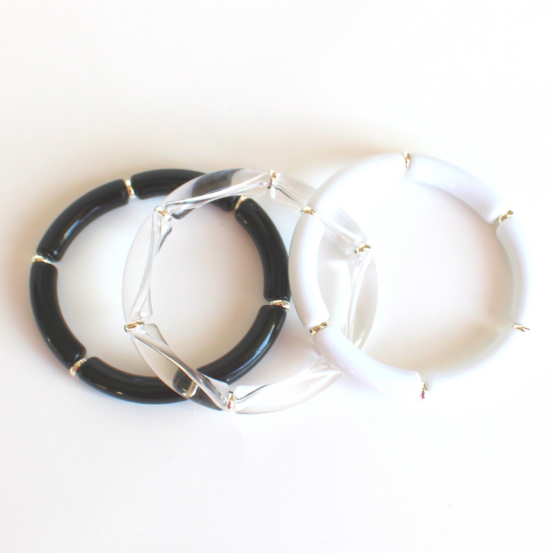 Clear acrylic bangle with silver beads. This lightweight bangle is versatile and will go with any bracelet in your jewerly box.