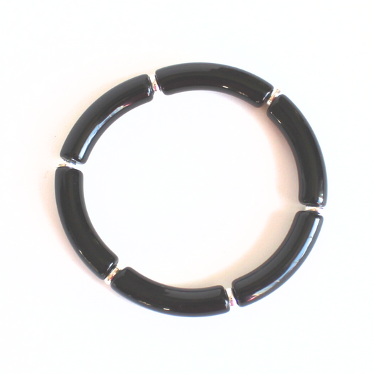 Black acrylic bangle with silver beads. This lightweight bangle is versatile and will go with any bracelet in your jewelry box.