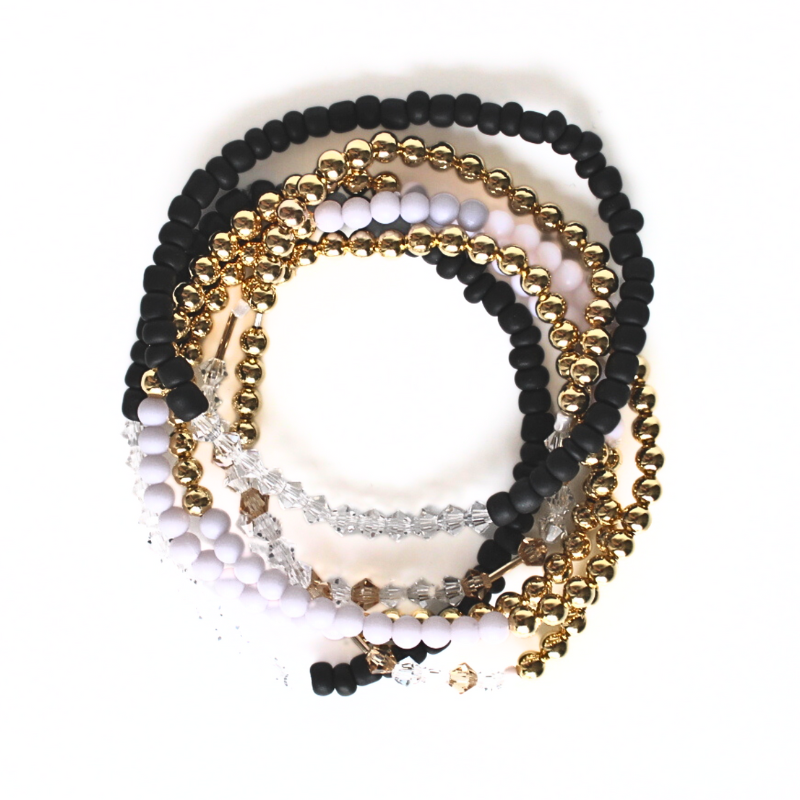 Black and gray 18k gold filled beaded stretch friendship bracelets. This stack comes with 2 sets of 3 bracelets. One for you and one for your bestie. Each bracelet comes with beaded bracelet designed with a Morse code message "bestie" using crystal and gold beads.