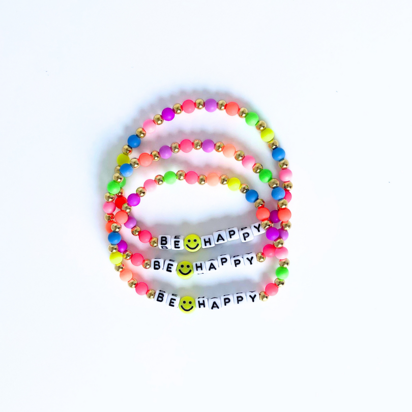 Dainty rainbow beaded letter bead bracelet. 4mm white cubed letter beads can be personalized with any word, initial or word of your choice.