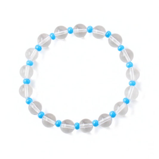 Clear translucent quartz beaded bracelet designed with dainty blue seed beads