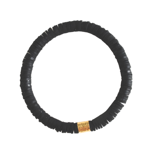 Black polymer clay beaded stretch bracelet. This lightweight beaded bracelet is designed with a gold-plated cylinder bead.