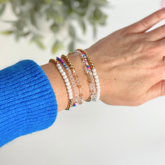 Matching best friend bracelets; one for you and one for you best friend. These beaded bracelets are not our typical childhood best friend bracelets. These best friend bracelets are curated with 18k gold filled round beads, white glass beads, blue rainbow see beads and crystal beads. Each bracelet is uniquely designed with a "bestie" Morse code message using crystal beads.