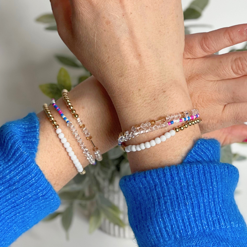 Matching best friend bracelets; one for you and one for you best friend. These beaded bracelets are not our typical childhood best friend bracelets. These best friend bracelets are curated with 18k gold filled round beads, white glass beads, blue rainbow see beads and crystal beads. Each bracelet is uniquely designed with a "bestie" Morse code message using crystal beads.