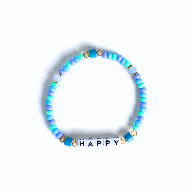 Blue seed beaded bracelet with customizable letter beads.