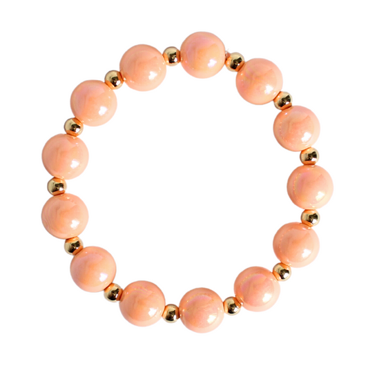 12mm large peach iridescent acrylic stretch beaded bracelet with 5mm 18k gold filled round beads alternating with each peach bead.