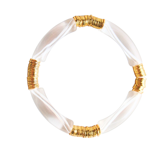 Clear acrylic bangle with gold flat beads. Moden bangle that is light and fun. Style with a casual look for a lunch date or a colorful dress for a night out.