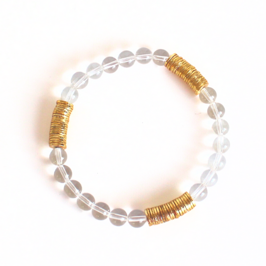 Simple yet sophisticated clear quartz gemstone beaded bracelet will add a little extra sparkle to your stack. Curated with gold plated flats this bracelet is simple yet elegant.