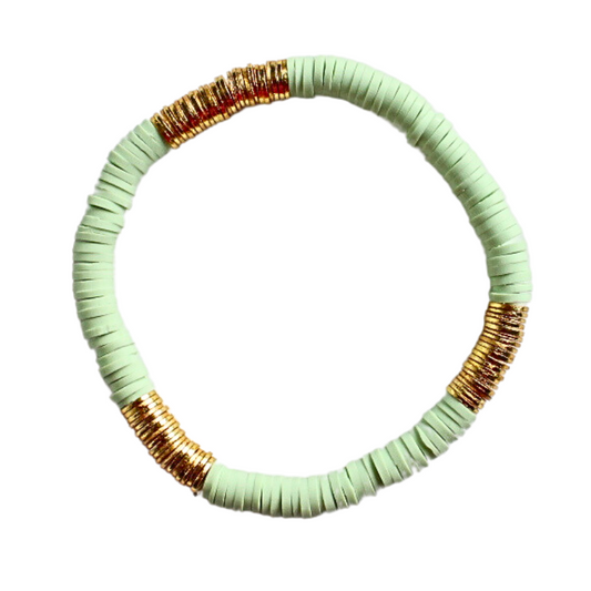 Single beaded pop of color stretch bracelet for layering and stacking. Curated with blue polymer clay beads and gold-plated flat beads, this classic bracelet will add a timeless look to any outfit or bracelet stack. Wear alone or add to any bracelet to create the perfect look.