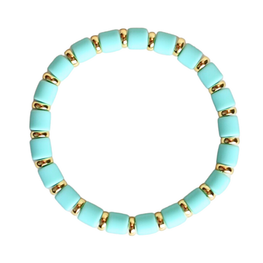 Single beaded bright and bold stretch bracelet for layering and stacking. Curated with mint green polymer clay wide beads and gold-plated flat beads, this playful bracelet will add a pop of color to any outfit or bracelet stack. Wear alone or add to any bracelet to create the perfect look.