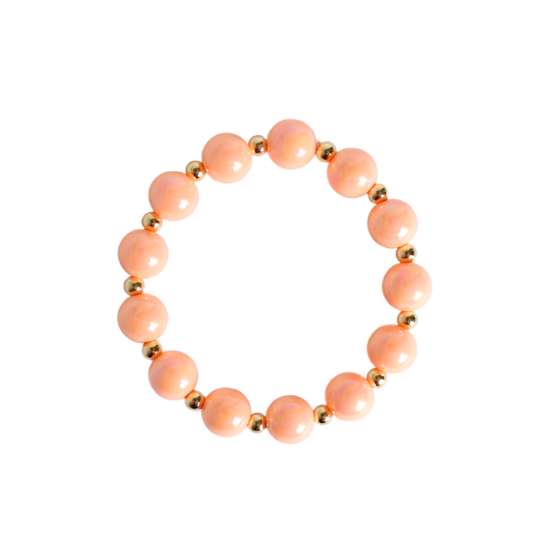 12mm large peach iridescent acrylic stretch beaded bracelet with 5mm 18k gold filled round beads alternating with each peach bead.
