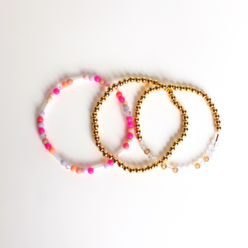 Matching best friend bracelets; one for you and one for you best friend. These beaded bracelets are not our typical childhood best friend bracelets. These best friend bracelets are curated with 18k gold filled round beads, pink glass beads, and crystal beads. Each bracelet is uniquely designed with a "bestie" Morse code message using crystal beads.