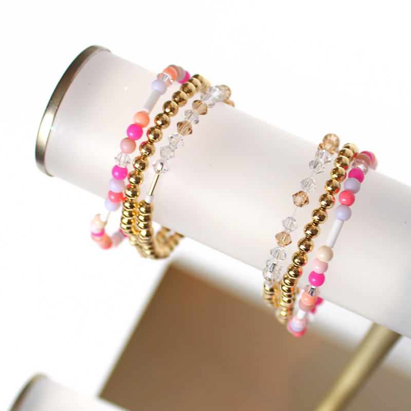 Matching best friend bracelets; one for you and one for you best friend. These beaded bracelets are not our typical childhood best friend bracelets. These best friend bracelets are curated with 18k gold filled round beads, pink glass beads, and crystal beads. Each bracelet is uniquely designed with a "bestie" Morse code message using crystal beads.
