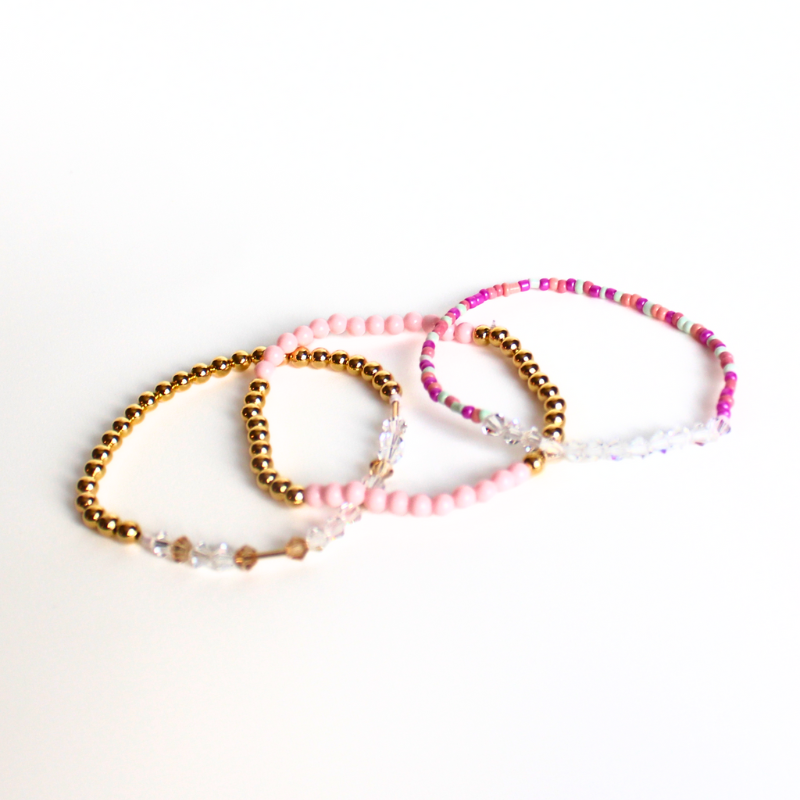 Matching best friend bracelets; one for you and one for you best friend. These beaded bracelets are not our typical childhood best friend bracelets. These best friend bracelets are curated with 18k gold filled round beads, pink rainboe glass beads, and crystal beads. Each bracelet is uniquely designed with a "bestie" Morse code message using crystal beads.