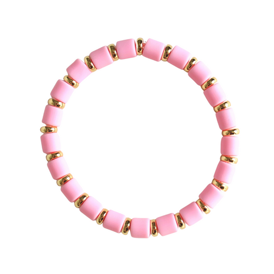 Single beaded bright and bold stretch bracelet for layering and stacking. Curated with pink polymer clay beads and gold-plated flat beads, this playful bracelet will add a pop of color to any outfit or bracelet stack. Wear alone or add to any bracelet to create the perfect look.