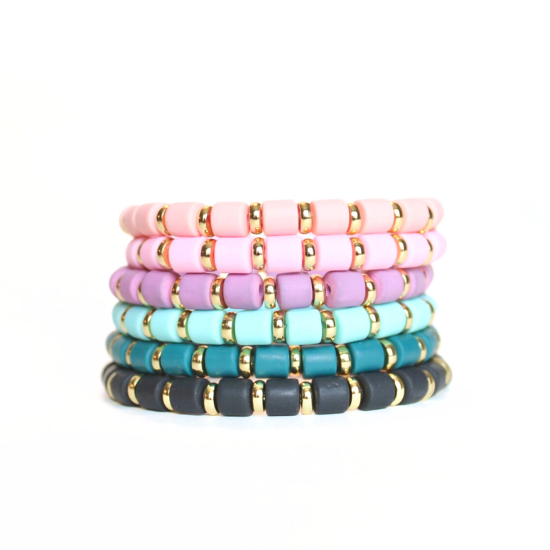 Single beaded bright and bold stretch bracelet for layering and stacking. Curated with pink polymer clay beads and gold-plated flat beads, this playful bracelet will add a pop of color to any outfit or bracelet stack. Wear alone or add to any bracelet to create the perfect look.