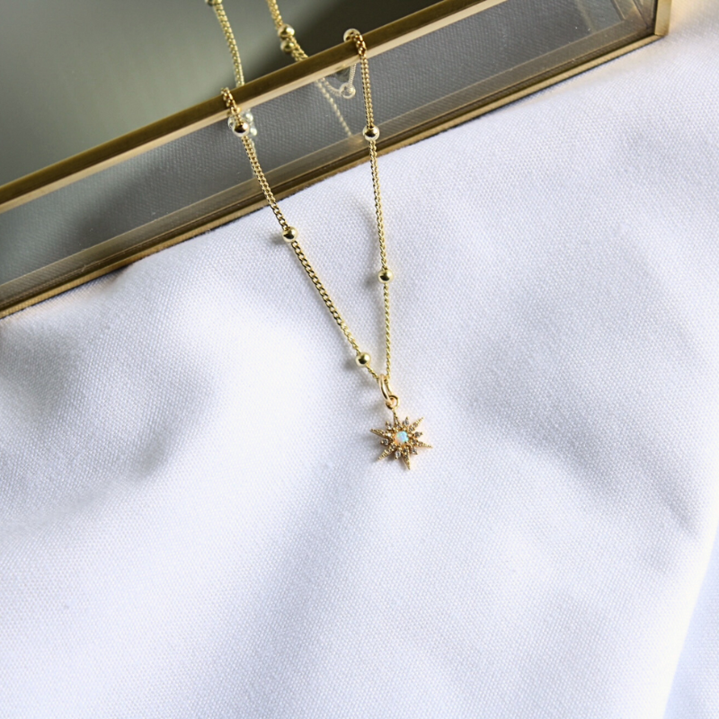 Elegant gold-filled satellite chain necklace with a gold star opal charm