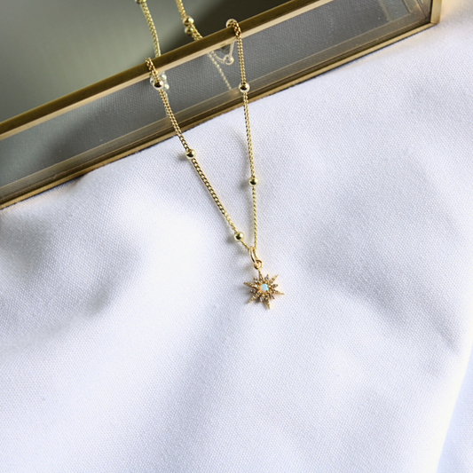 Elegant gold-filled satellite chain necklace with a gold star opal charm
