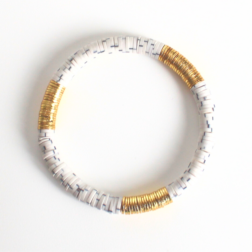 White and gray polymer clay bracelet with gold flat beads.