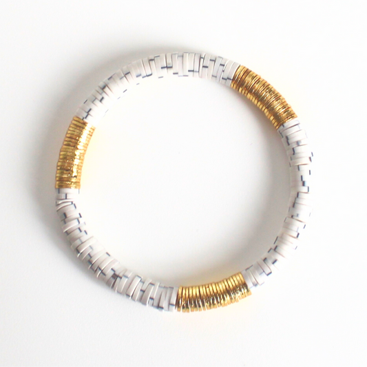 White and gray polymer clay bracelet with gold flat beads.
