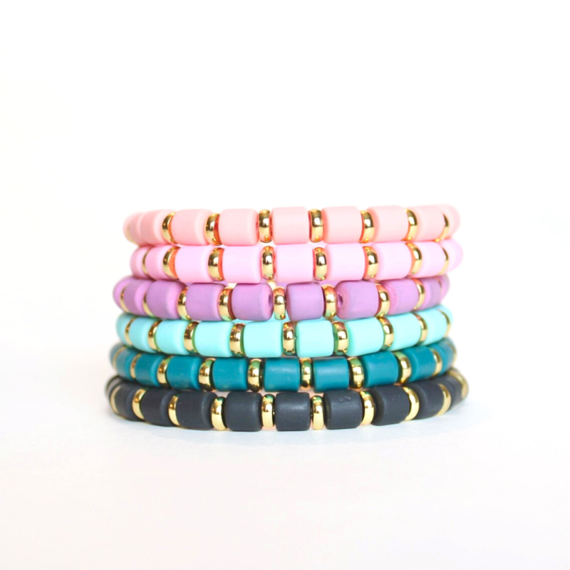 Single beaded bright and bold stretch bracelet for layering and stacking. Curated with pink polymer clay beads and gold-plated flat beads, this playful bracelet will add a pop of color to any outfit or bracelet stack. Wear alone or add to any bracelet to create the perfect look.