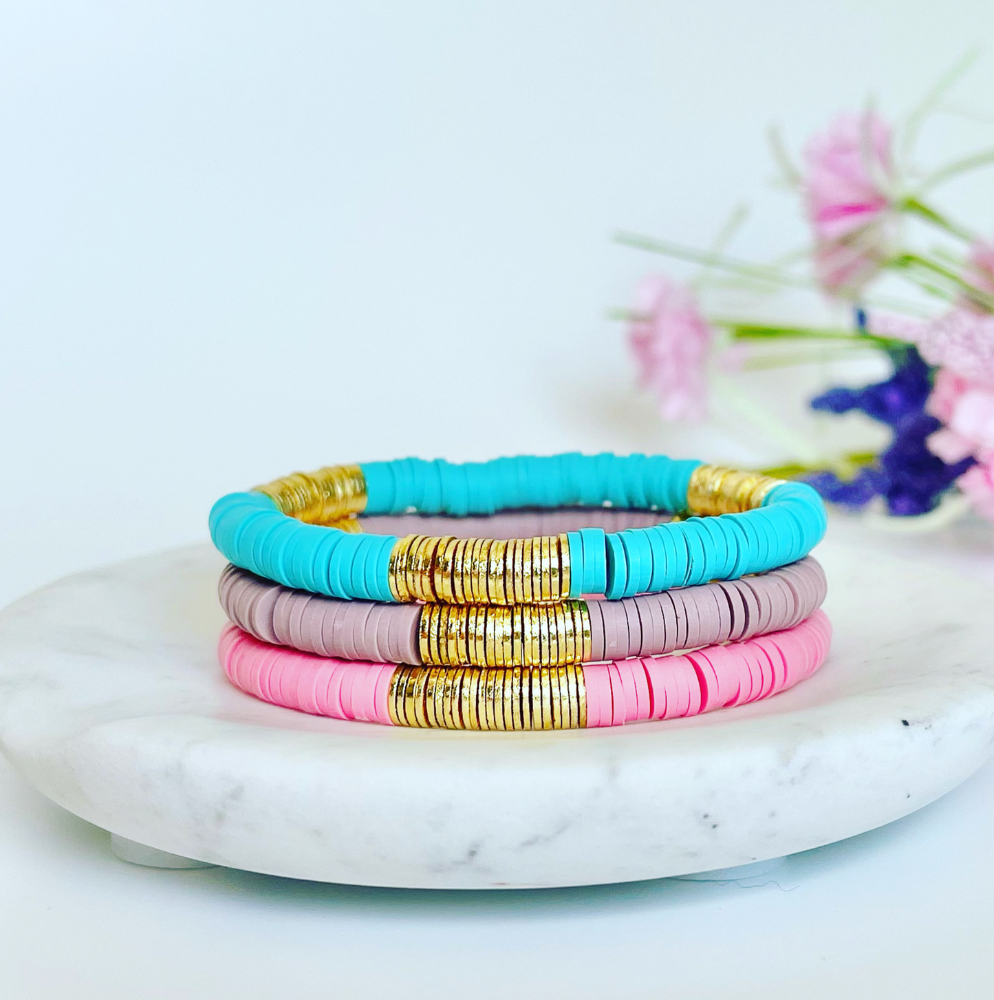 Single beaded bright and bold stretch bracelet for layering and stacking. Curated with pink polymer clay beads and gold-plated flat beads, this playful bracelet will add a pop of color to any outfit or bracelet stack. Wear alone or add to any bracelet to create the perfect look. Mother's Day gift