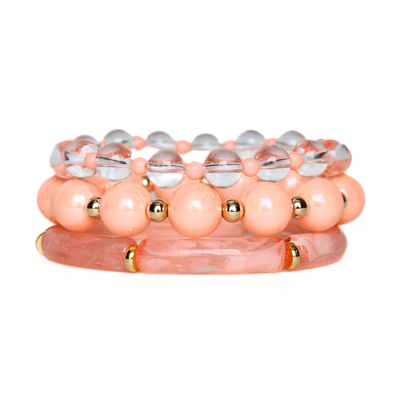 3-piece peach acrylic bangle bracelet set with clear quartz gemstones