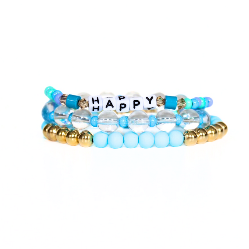 3-piece blue and clear quartz gemstone beaded bracelet stack. Designed with white cubed letter beads that can be personalized with a name, initial or inspirational words.