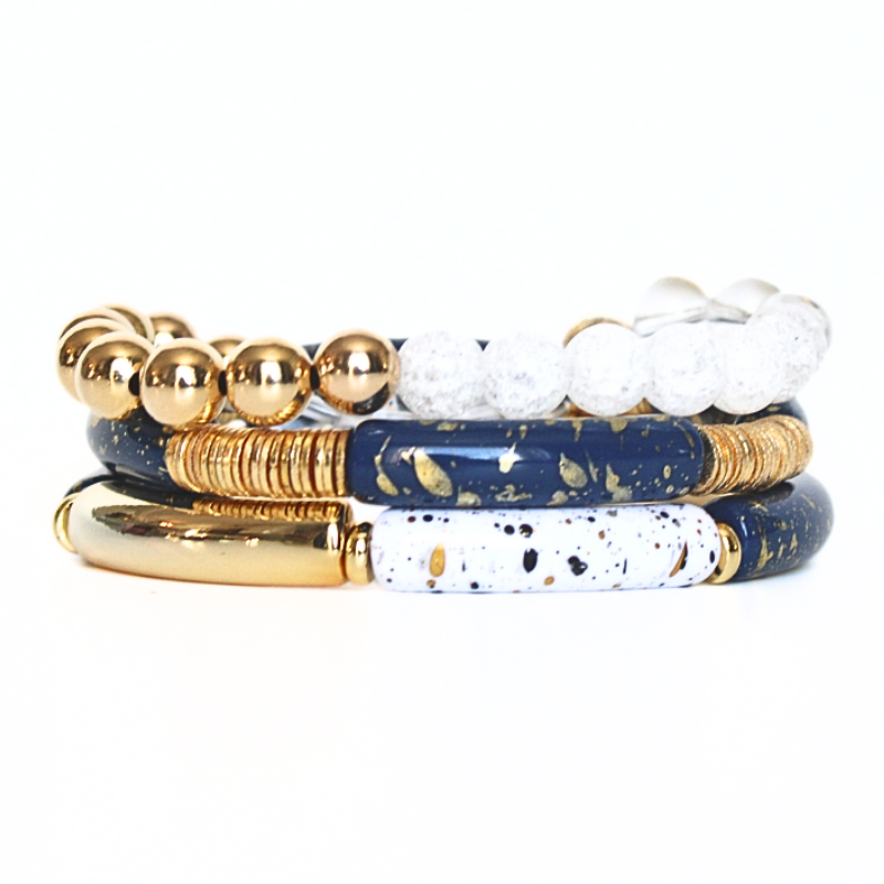 Three Piece stretch beaded bracelet set featuring 18k gold filled beads, natural semi-precious gemstones. This set includes one beaded bracelet and two bangle style bracelets. Wear this stack with your holiday outfit for some extra sparkle